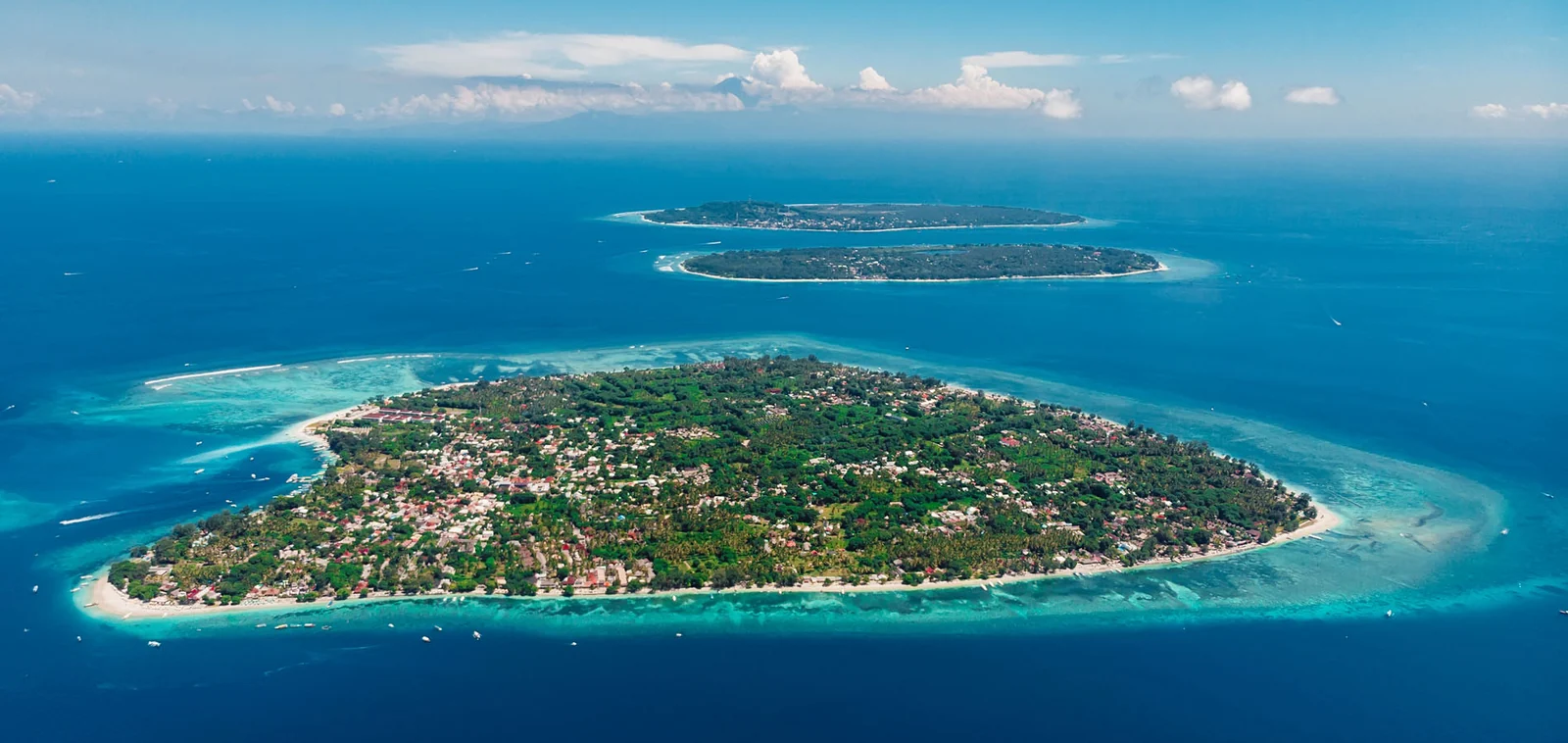 Gili Air from the air, ringed by reef, with Gili Meno and Gili Trawangan behind